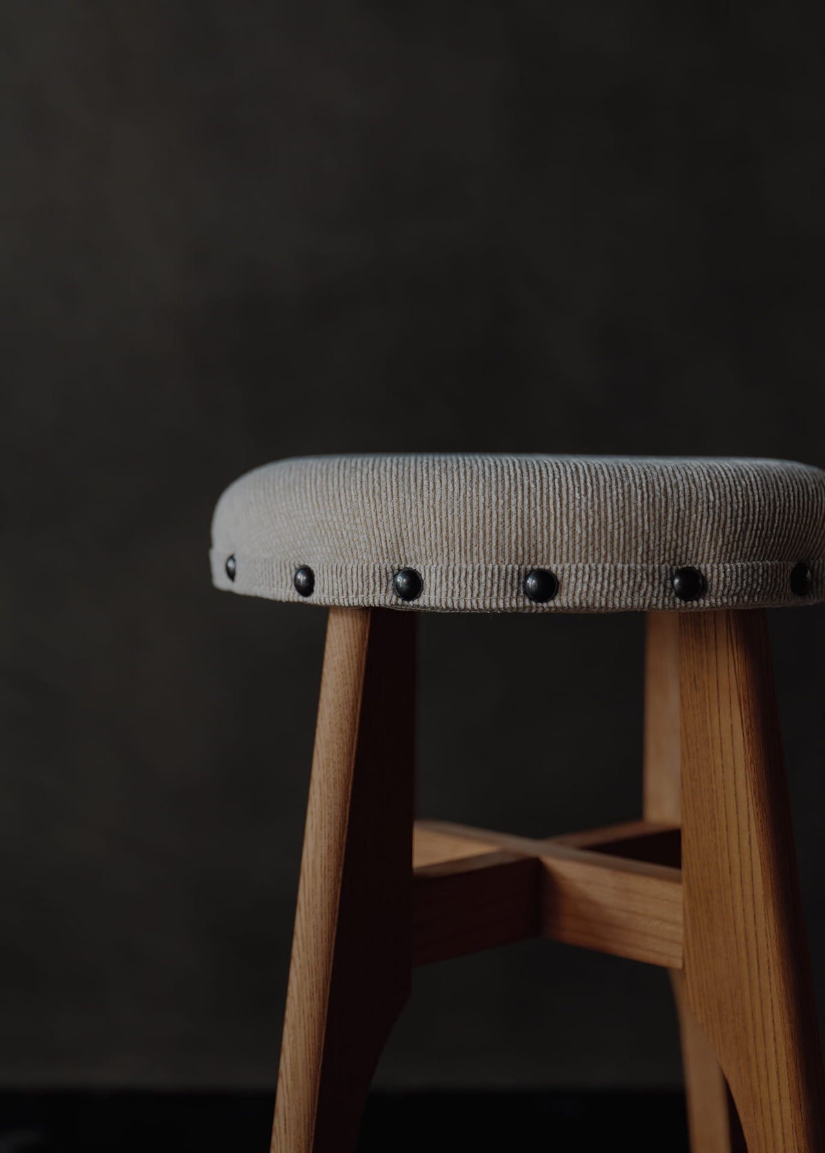 Keyaki-wood fabric-upholstered round stool